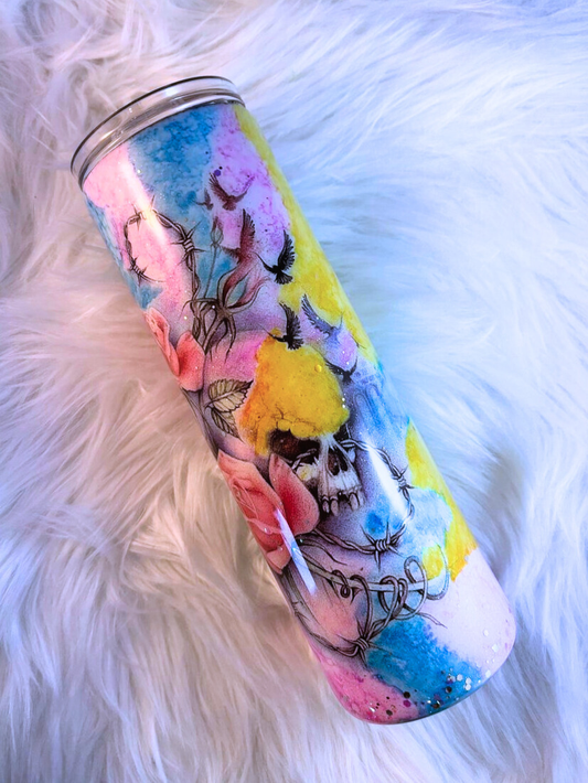 Colorful tumbler with artistic design on a white fluffy surface