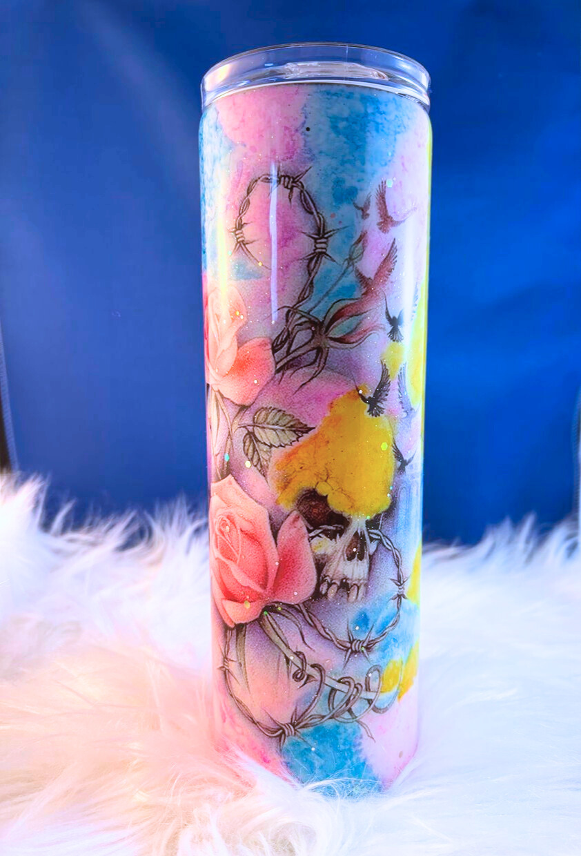 Tumbler with floral design on a blue background