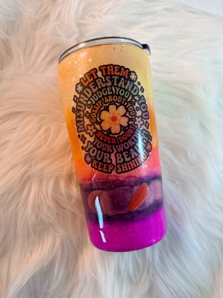 20oz handmade epoxy tumbler with yellow to pink ombre glitter, retro 70s flower style quote decal, and autumn leaf details.