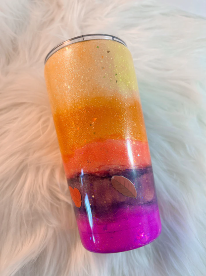 20oz handmade epoxy tumbler with yellow to pink ombre glitter, retro 70s flower style quote decal, and autumn leaf details.